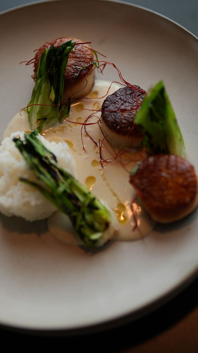 Seared scallops with charred greens and rice